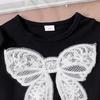 Conjunto de dos piezas de falda y tutú de malla con top de manga corta y lazo para niñas de talla pequeña y mediana de verano de estilo europeo y americano.