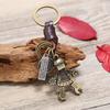 Llavero caliente estilo coreano de cuero vacuno, adornos para llaves, aleación, robot, para hombre, cuero genuino, joyería de moda personalizada al por mayor