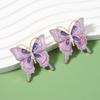 Aretes Europeos y Americanos Transfronterizos de Nueva Moda Lujo Ligero Diseño Nicho Insecto Mariposa Aleación Goteo de Aceite Imitación Perla Aretes para Mujer