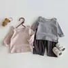 Novas Camisetas de Manga Longa para Meninos e Meninas da Primavera e Outono Cor Sólida Orelhas de Desenho Animado Pulôver para Bebês e Crianças Pequenas Roupa de Baixo Cor Sólida