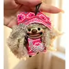 Encantador perrito peludo con la lengua fuera, llavero para bolso, colgante de dibujos animados natural, semillas de terapia de sonido curativas, popular en zonas escénicas, amuleto divertido y adorable