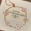 Pulsera de trébol de cuatro hojas con pétalos de imitación de nácar para mujer, cordón para la mano de mujer, pulsera para mejor amiga de mujer, anillo de mano exquisito de nicho de lujo ligero, joyería para la mano