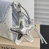 Bolso de mano de tres capas con estampado de estrellas altamente atractivo y gran capacidad, adecuado para maquillaje, cámaras instantáneas y teléfonos móviles