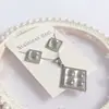 Nuevo especial transfronterizo explosión de tendencia europea y americana titanio acero alta calidad color collar pendientes traje femenino joyería de concha real