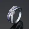 Anillo de cobre con forma de lazo de deseo transfronterizo anillo con gema púrpura incrustada joyería de nicho con temperamento disponible