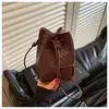 Bolso pequeño con diseño transfronterizo y patrón tejido para mujer, nuevo y moderno bolso tipo cubo de alto valor, bolso cruzado de hombro único vintage, moderno