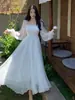 Vestido de Vacaciones en la Playa Sanya Estilo Nuevo 2026, Vestido de Playa Blanco de Gasa de Alta Gama con Dobladillo Grande, Vestido Ultralargo