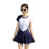 Traje de baño de una pieza estilo falda para niñas de 8 a 15 años, manga corta, protección solar, con cierre, venta al por mayor para estudiantes y niños