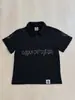 Camiseta de Verano de Manga Corta Estilo Ins Transfronterizo con Calavera de Pedrería Oscura, Diseño de Hebilla Metálica Lateral y Cuello Solapa, Top de Corte Holgado