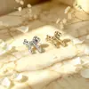 Pendientes de lazo dorado transfronterizos europeos y americanos, elegantes y modernos, con un diseño de alta gama y único, hechos de metal