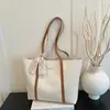 Bolso grande para mujer 2026 nuevo bolso de hombro de moda primavera-verano, bolso tote de nicho de gran capacidad para la escuela y el trabajo