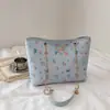 Bolsa feminina estilo grafite 2026 nova moda estudante universitário versátil bolsa de ombro bolsa tote de grande capacidade