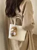 Bolsa Balde de Mão com Design de Nicho Estilo Coreano para Mulheres Nova Moda Primavera 2026 Bolsa de Ombro Transversal Simples e Elegante