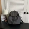 Mochila ligera INS de estilo callejero coreano, casual y elegante para mujer 2026, mochila de cuadros atmosférica para el uso diario informal y la escuela