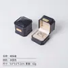 Caja de joyería de cuero aceitado de alta gama con etiqueta octagonal dorada, caja para anillos, colgante, pulsera, collar, embalaje para accesorios, caja de almacenamiento de joyería