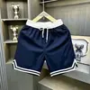Shorts de corte holgado, con bloques de color, de longitud hasta la rodilla para hombre, nuevo estilo de verano, transpirables y de secado rápido, adecuados para correr, deportes, baloncesto, entrenamiento y fitness