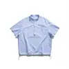 Camisa de Rayas Azules y Blancas con Cuello Alto Estilo Americano de Moda Nanxia para Hombre, Primavera 2026 Camisa Casual de Bolsillo sin Botones