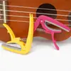 Capo para Guitarra y Afinador Combo al por Mayor en Stock, Afinador de Guitarra Acústica de Plástico Multiusos