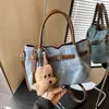 Bolsa de Mão Retro de Nicho Versão Coreana Transfronteiriça Nova Primavera 2026 Grande Capacidade para o Dia a Dia Ombro Sob o Braço Bolsa Tote