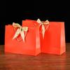Bolsa de papel portátil con lazo de color, de fondo cuadrado, con embalaje exquisito, para regalo, ropa, compras, logotipo imprimible.