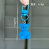 Lindo Oso de Peluche Sentado Tridimensional de Colores Llavero Colgante para Bolso Colgante Pequeño para Coche Regalo para Mejor Amiga Venta al por Mayor