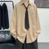 Camisa de color liso con corbata, nueva camisa versátil retro de estilo Hong Kong para primavera/otoño, manga larga, top casual holgado unisex, moderno