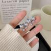 Pendientes de circonita con lazo Starlight, diseño de moda de lujo ligero, pendientes exagerados, joyería de alta gama para celebridades de Internet.