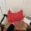 Bolsa de Cor Sólida com Textura Trançada Feminina Outono 2026 Nova Bolsa de Ombro Único Moda Bolsa de Mão Bolsa Transversal de Grande Capacidade Pingente