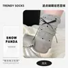 Calcetines de encaje de lunares con lazo calcetines holgados calcetines de verano para mujer estilo nicho pasarela calcetines de media pantorrilla estilo coreano calcetines de moda Dongdaemun