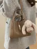 Bolsa de hombro cruzada de alta gama de nicho versátil, bolsa de cubo, bolsa de hombro, bolsa de mensajero, cesta de verduras, nueva para Otoño e Invierno 2025, transfronteriza