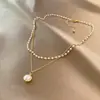 Collar con colgante de perlas de doble capa minimalista para mujer, versátil y elegante, con un aire de moda de alta gama, cadena para la clavícula de diseño único