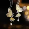 Pendientes Largos con Borla para Mujer, Aretes Colgantes de Mariposa Huecos Tridimensionales en Plata y Oro con un Diseño Elegante y Único