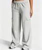 Nuevos pantalones cargo deportivos unisex de moda de color liso con múltiples bolsillos y cordón, pierna ancha, holgados, para comercio exterior transfronterizo