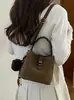 Bolso de mano nuevo de comercio exterior transfronterizo, bolso tipo cubo moderno y elegante para mujer, con un diseño único, adecuado para el trabajo diario, y se puede llevar como bolso de hombro o bolso cruzado