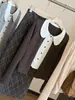 Camiseta de punto dulce estilo coreano con bloques de color, efecto dos piezas, cuello de muñeca para mujer, nueva colección de otoño, cárdigan top casual y versátil de manga larga