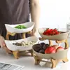 Plato de frutas creativo de doble capa multicapa estilo europeo de cerámica para frutas secas con soporte de bambú plato de sushi para el hogar cesta de frutas directo de fábrica