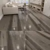 Piso Lvt Ventas de Exportación Piso para Interiores Piso de Piedra Plástico Piso Autoadhesivo Actualización de Piso Resistente al Desgaste Retardante de Llama Pegatina de Piso de PVC