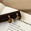 Brincos Minimalistas Estilo Francês Moda Retrô Versátil Luxo Leve High-End Pedra Olho de Tigre Nicho Elegante Temperamento Personalidade Acessórios de Orelha
