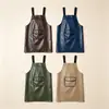 Delantal moderno impermeable y a prueba de aceite de PU lavable para cocina casera, delantal de cocina modelo nuevo, ropa de trabajo especializada para catering con texto impreso