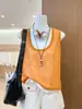 Camisola de punto naranja de imitación de dos piezas para mujer, estilo fino de verano, prenda exterior adelgazante, top sin mangas