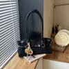Bolso de mano vintage de alta gama transfronterizo para mujer, nuevo modelo otoño 2026, bolso versátil casual para hombro y axila para el trabajo
