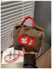 Bolso de mano de nailon estilo ins japonés para mujer, bolso de hombro bordado, bolso casual para teléfono móvil y monedas, bolso cruzado moderno y ligero