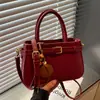 Bolso de mano de diseño nicho de moda nuevo otoño 2026 transfronterizo, bolso de hombro cruzado versátil de color liso simple y elegante
