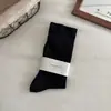 Calcetines sin costuras para mujer, engrosados y de caña alta para primavera y otoño, calcetines holgados para maternidad, calcetines holgados de color liso versátiles estilo japonés, calcetines largos Maillard
