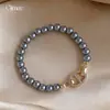 Pulsera de Perlas con Nariz de Cerdo de Circonita Estilo Retro Francés, Sensación de Lujo Ligero y Gama Alta, Joyería de Mano Moderna y Versátil para Mujeres
