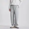 Pantalones deportivos de otoño para hombre, color liso, corte holgado, versátiles, con cordón, pierna ancha, diseño curvo