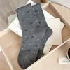 Calcetines lindos para mujer para otoño, calcetines de media pantorrilla, diseño de cachorro de dibujos animados sin costuras, calcetines largos grises de moda para otoño e invierno, calcetines para mujer con lazo