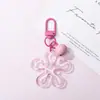 Llavero con hebilla de flor hueca transparente fresca y colorida, accesorio de campana, colgante para bolso, venta al por mayor