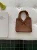 Bolso de punto de lana estilo coreano para otoño e invierno con correa de amarre, adecuado para el trabajo, gran capacidad, nicho, bolso de hombro versátil