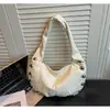 Bolso de hombro de moda coreano transfronterizo con tachuelas para mujer, nuevo bolso tipo dumpling casual de gran capacidad versátil, bolso de axila a la moda